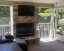 Addition of cozy screened-in porch with a fireplace added.