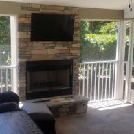 Screened-in porch/den addition with fireplace 